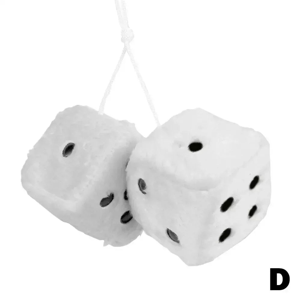 White plush velvet dice shaped like a cube with black dots, suspended by a white string.