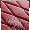 Close-up texture of a pink leather seat cover showing stitching and anti-slip patterns.