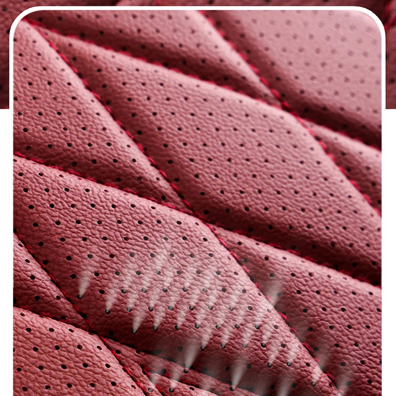 Close-up texture of a pink leather seat cover showing stitching and anti-slip patterns.