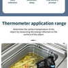 A hand holds a digital infrared thermometer measuring the temperature of french fries in a metal tray.
