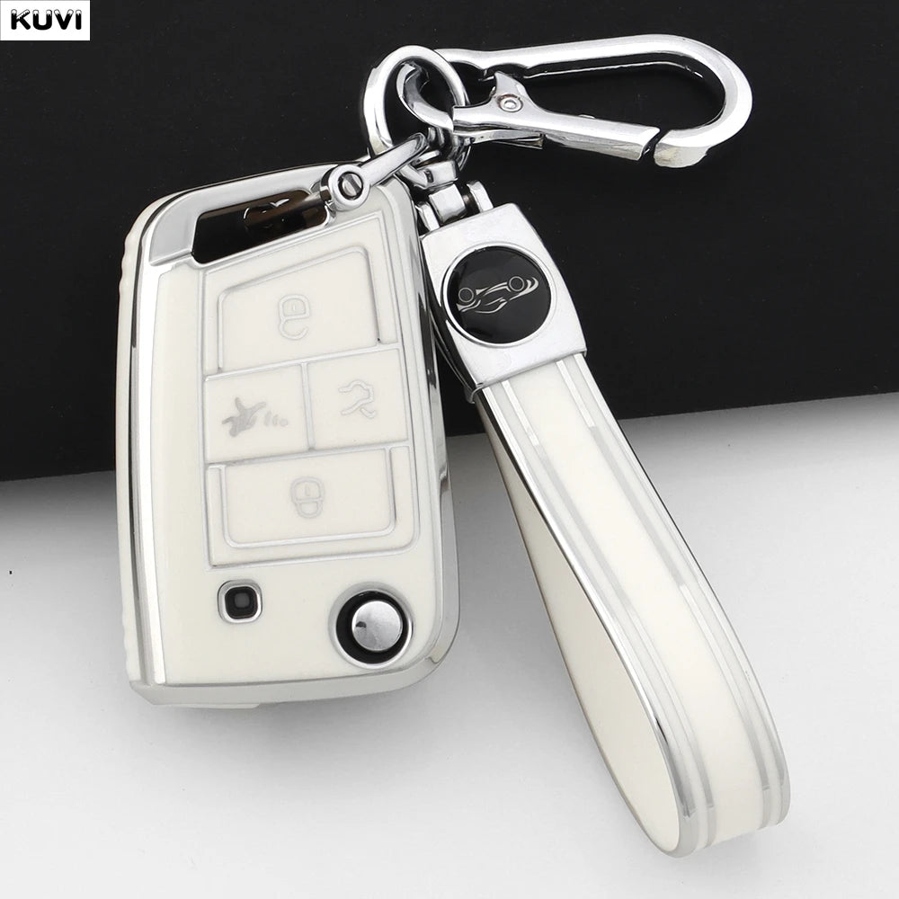 A silver key cover with a metal clip and a handle is shown against a white background.
