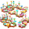 A colorful building toy featuring plastic flowers and plants arranged in a garden landscape.