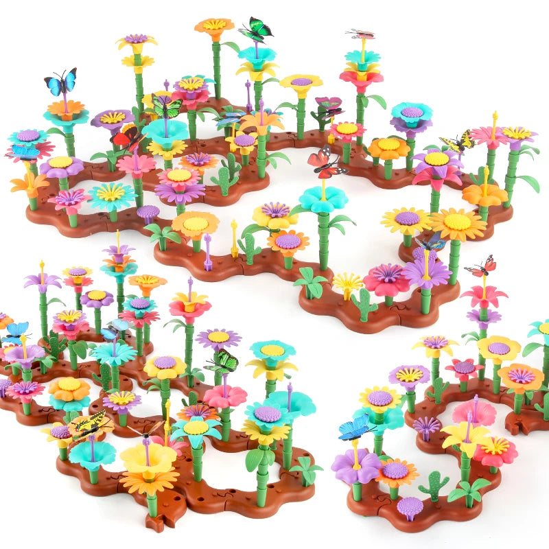A colorful building toy featuring plastic flowers and plants arranged in a garden landscape.