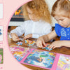 A child is playing with a colorful magnetic puzzle featuring unicorn and mermaid princesses.