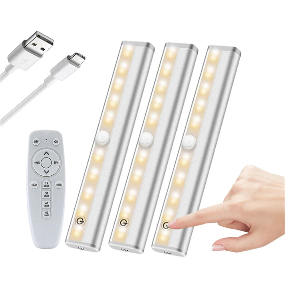 Three rechargeable LED under-cabinet lights with a remote control and touch sensor shown next to a hand