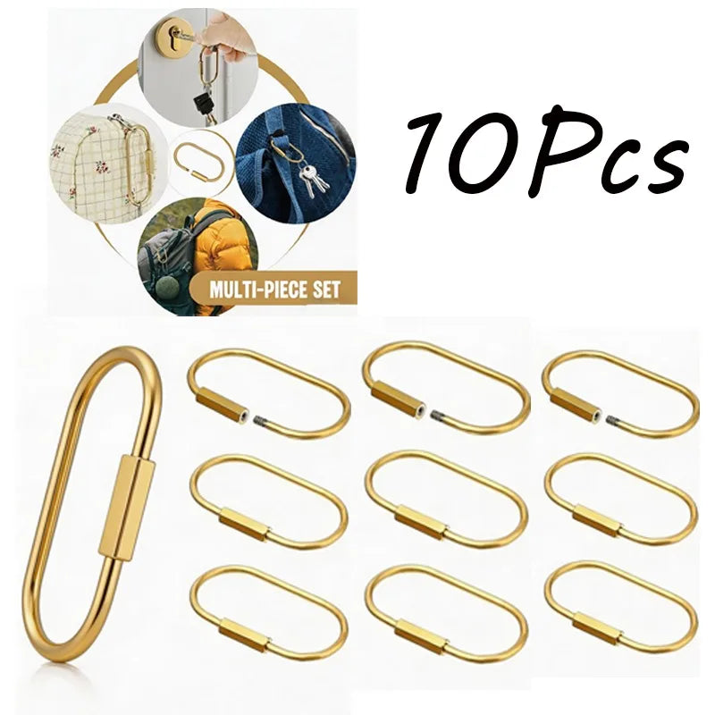 A set of ten brass gold keychain charms with secure carabiner clips shown in various angles.