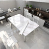 A modern kitchen featuring a white marble dining table and contemporary cabinetry.