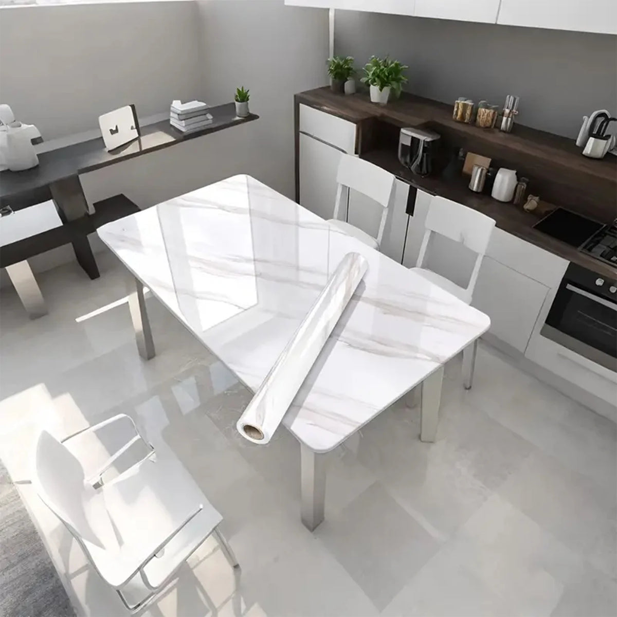 A modern kitchen featuring a white marble dining table and contemporary cabinetry.