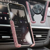 A crystal pink car phone holder with a vent mount is shown attached to a smartphone inside a car dashboard.