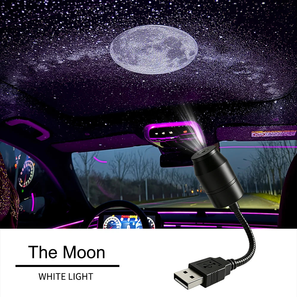 A white light moon projector is mounted in a car ceiling, casting a starry effect onto the interior.