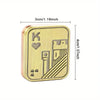 A gold-colored metal fidget slider toy featuring a stylized crown and castle design.