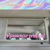 A car mirror features a pink text decal that reads passenger princess