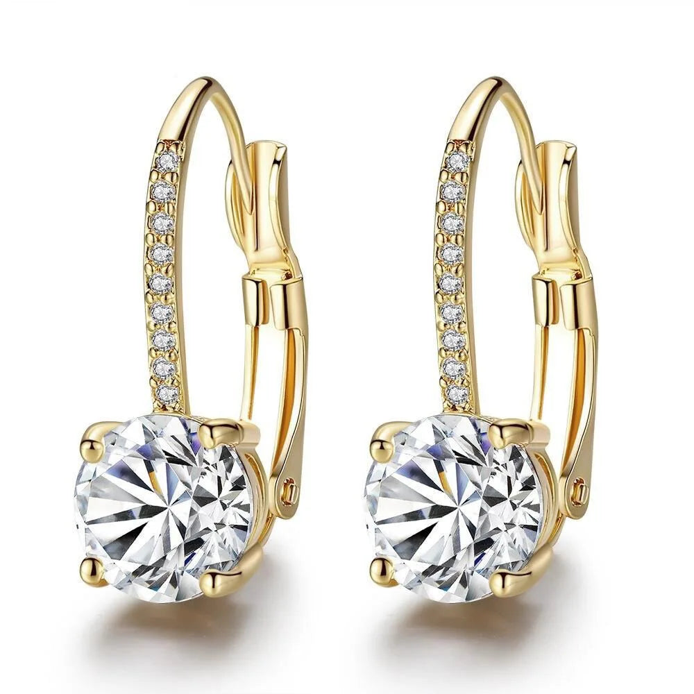 Gold-toned hoop earrings featuring clear stones and pave diamond accents.