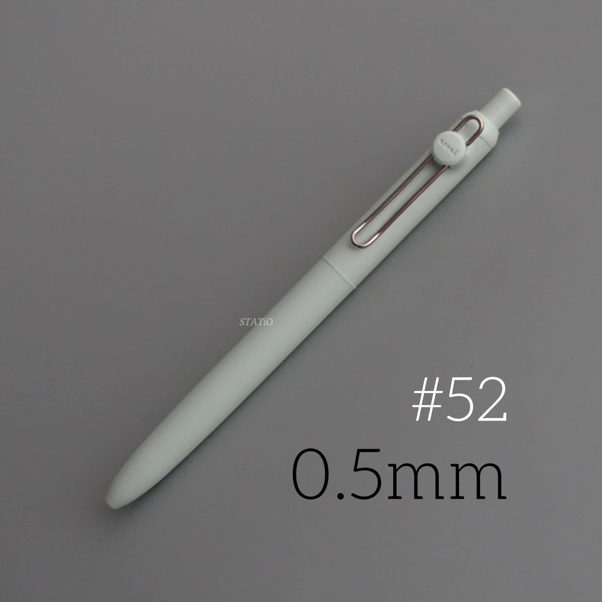 A close-up view of a light green Uni ZENTO Quick-Dry Gel Pen with a silver clip and 0.5mm tip.