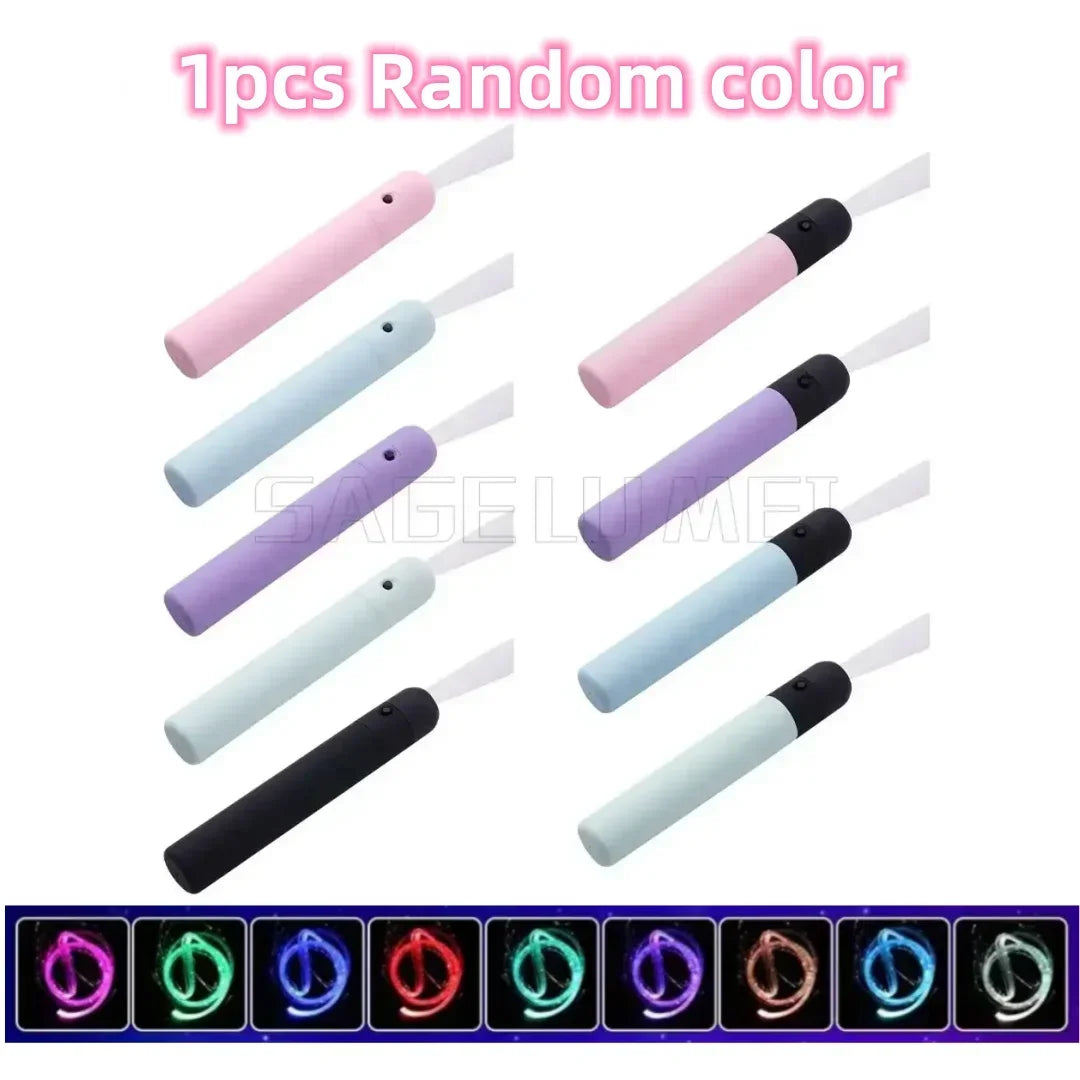 A set of 12 LED fiber optic dance whips in various random colors and designs.