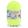 A ball of bright yellow milk cotton blend yarn for knitting and crochet projects.