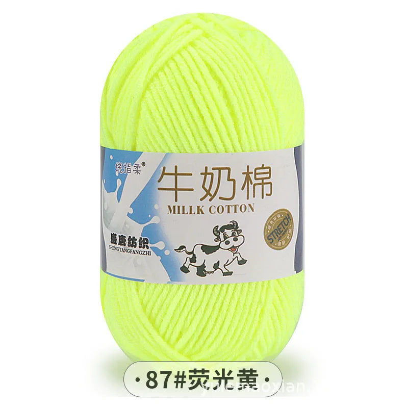 A ball of bright yellow milk cotton blend yarn for knitting and crochet projects.