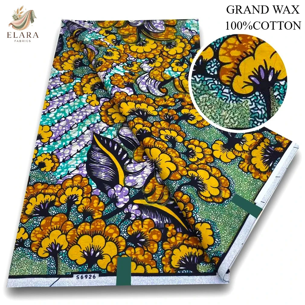 A bolt of pink glitter African wax print fabric featuring a vibrant yellow and green floral pattern.
