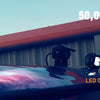 Close-up of a bright LED flood light pod mounted on a vehicle roof, highlighting its features and specifications.