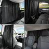 Black privacy curtains installed on the rear windows of a car, covering the interior view.