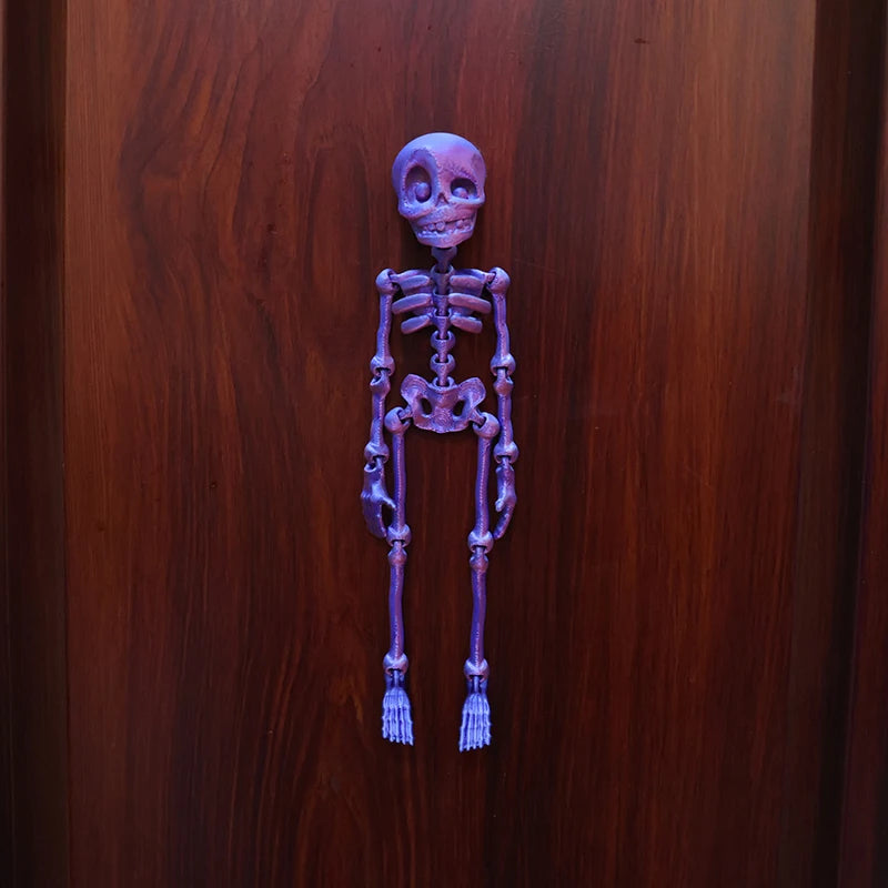 A purple, poseable luminous skull sculpture mounted on a wooden surface.