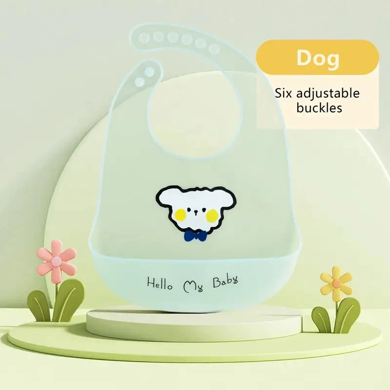 A light green silicone baby bib with a yellow cartoon bear design and six adjustable buckles.