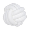 A white, hand-knotted velvet throw pillow with a round, textured design.