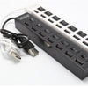 Schwarzer 7-Port-USB-Splitter-Hub mit Ein-/Ausschaltern und weißem Netzadapter.