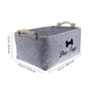 Gray felt pet toy storage basket with wooden handles shown from above.
