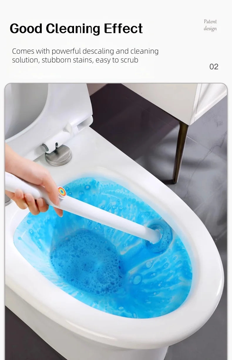 A hand is using a white toilet brush to clean the inside of a white toilet bowl, creating blue foam.