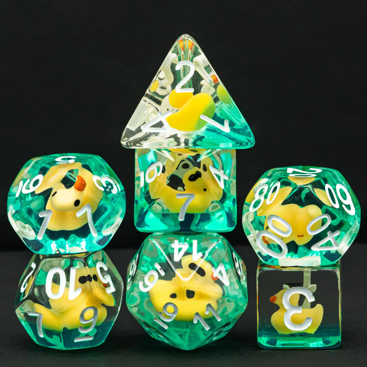 A set of resin dice shaped like adorable yellow animals for tabletop role-playing games
