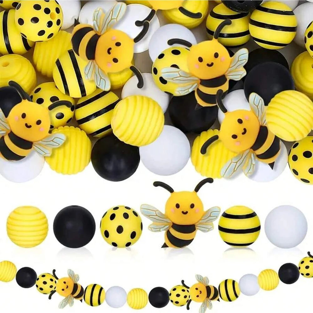 A collection of yellow and black silicone bee beads for jewelry making and DIY crafts.