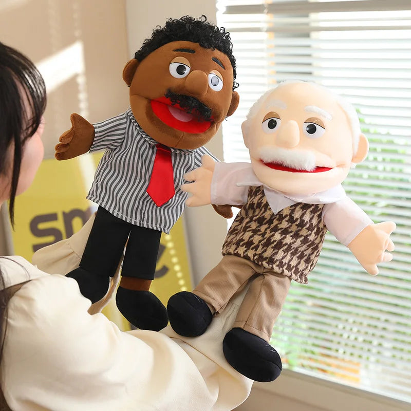 A puppet of a man with a mustache and white hair is being held by a person.