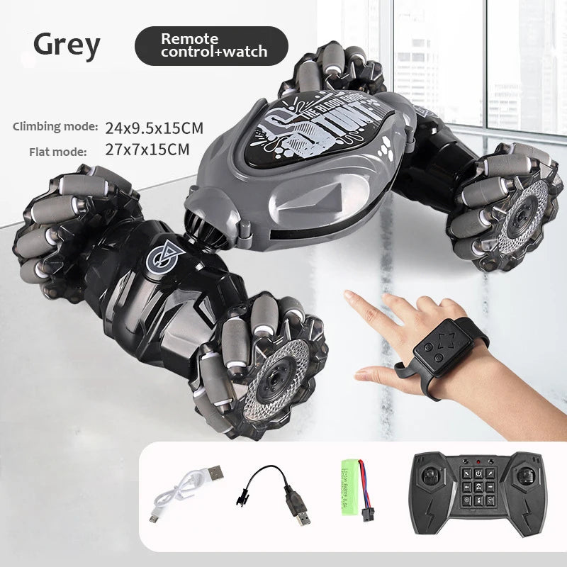 A grey remote control watch is shown with various modes and accessories for a stunt car vehicle.
