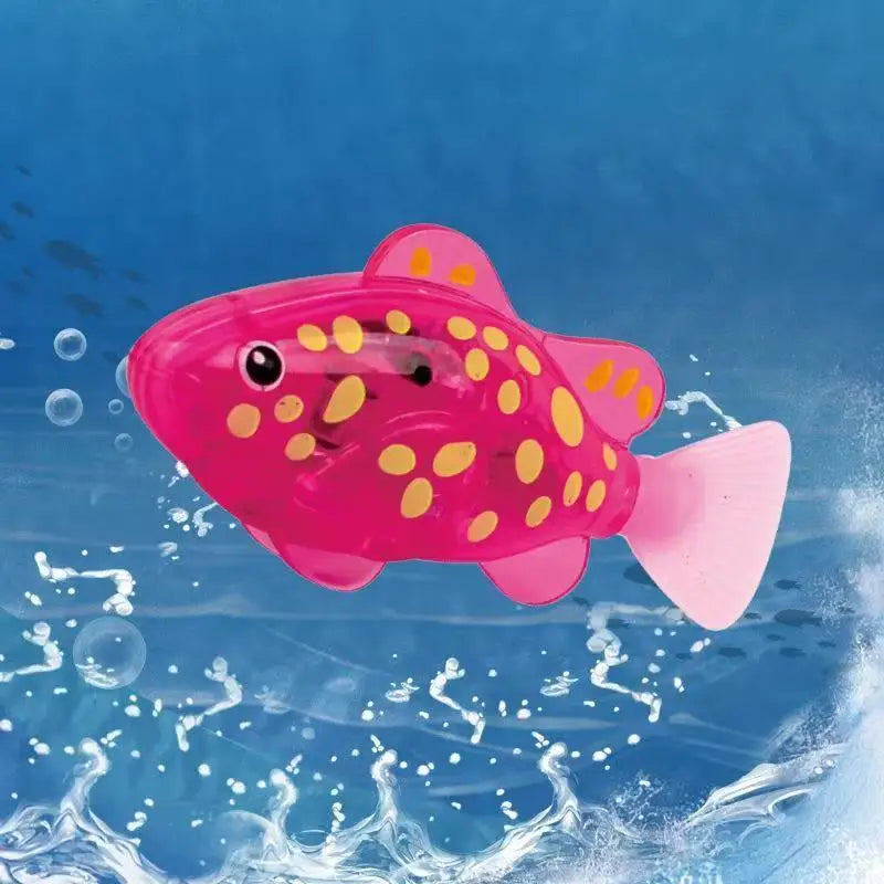 A bright pink light-up sensor swimming fish toy is shown splashing in blue water.