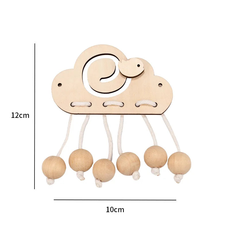 A wooden Montessori busy board featuring a cloud shape with a spiral design and hanging round wooden parts.