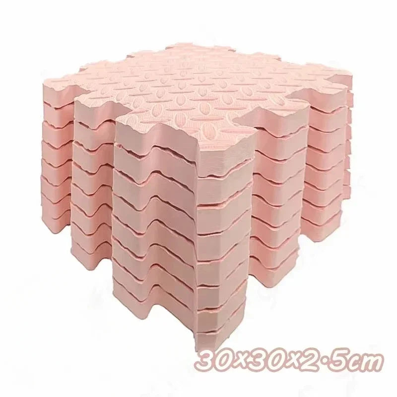 Eight interlocking pink foam play mats for babies and toddlers