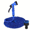 A blue expandable garden hose with a spray nozzle resting on a blue, circular mat.