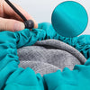 A hand is drawing a drawstring closure on a teal laundry bag, revealing a gray mesh interior.
