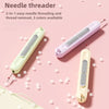 A pink and cream 2-in-1 needle threader tool is shown against a light pink background.