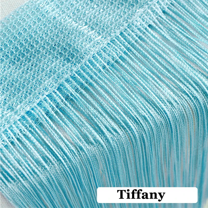 Close-up of light blue beaded thread curtain fabric showing the texture and weave.