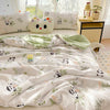 White comforter featuring a panda print pattern and lace trim, displayed on a bed with green accents.