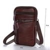A dark brown vintage genuine cowhide leather crossbody sling bag with a zippered compartment and adjustable strap.