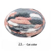 A round ball of gray and pink chenille yarn used for hand knitting projects.