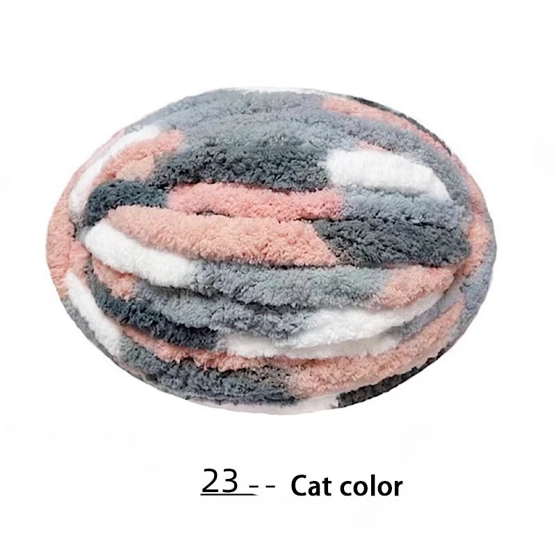 A round ball of gray and pink chenille yarn used for hand knitting projects.