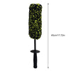 A black wheel barrel brush with a yellow and green bristled head and an ergonomic handle.