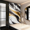 A modern kitchen featuring a marble countertop and a large abstract black and gold marble wall design.