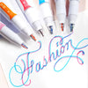 A set of six dual-color fluorescent marker pens with white and colored tips are displayed on a white background.