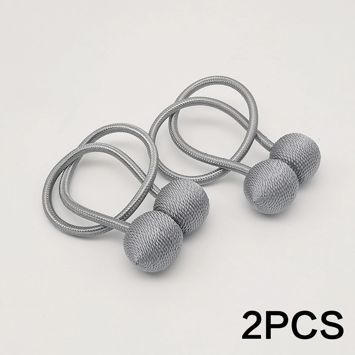 Deux serre-têtes magnétiques argentés minimalistes en forme de boule avec fils enroulés.