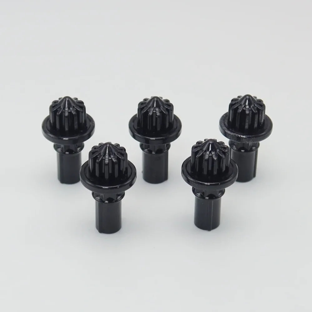 A set of five black replacement drivers for a Battling Top, packaged together.